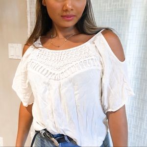 Off the shoulder cream shirt